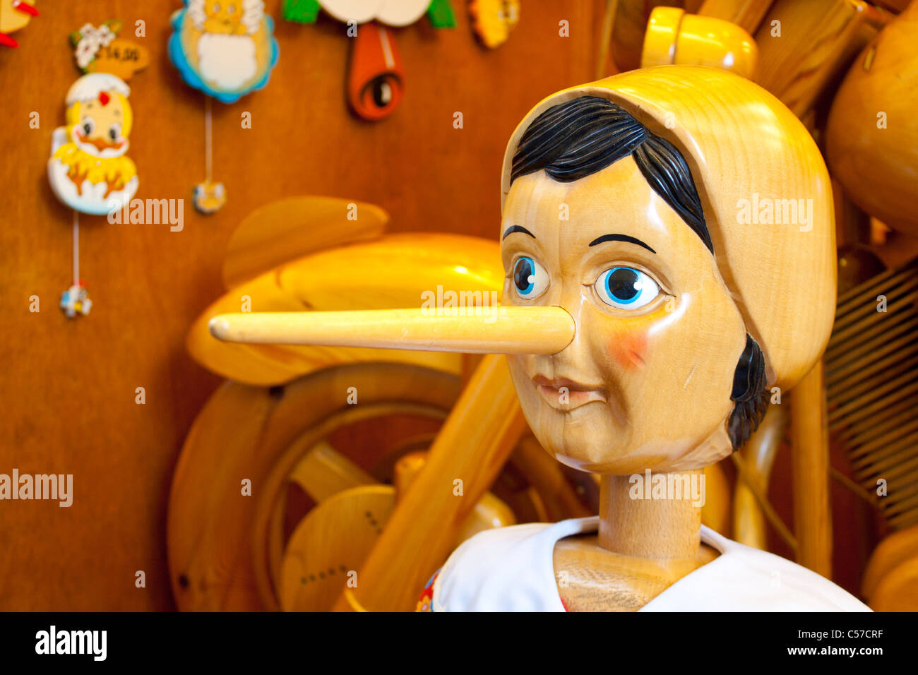 Wooden Pinocchio doll with long nose Stock Photo