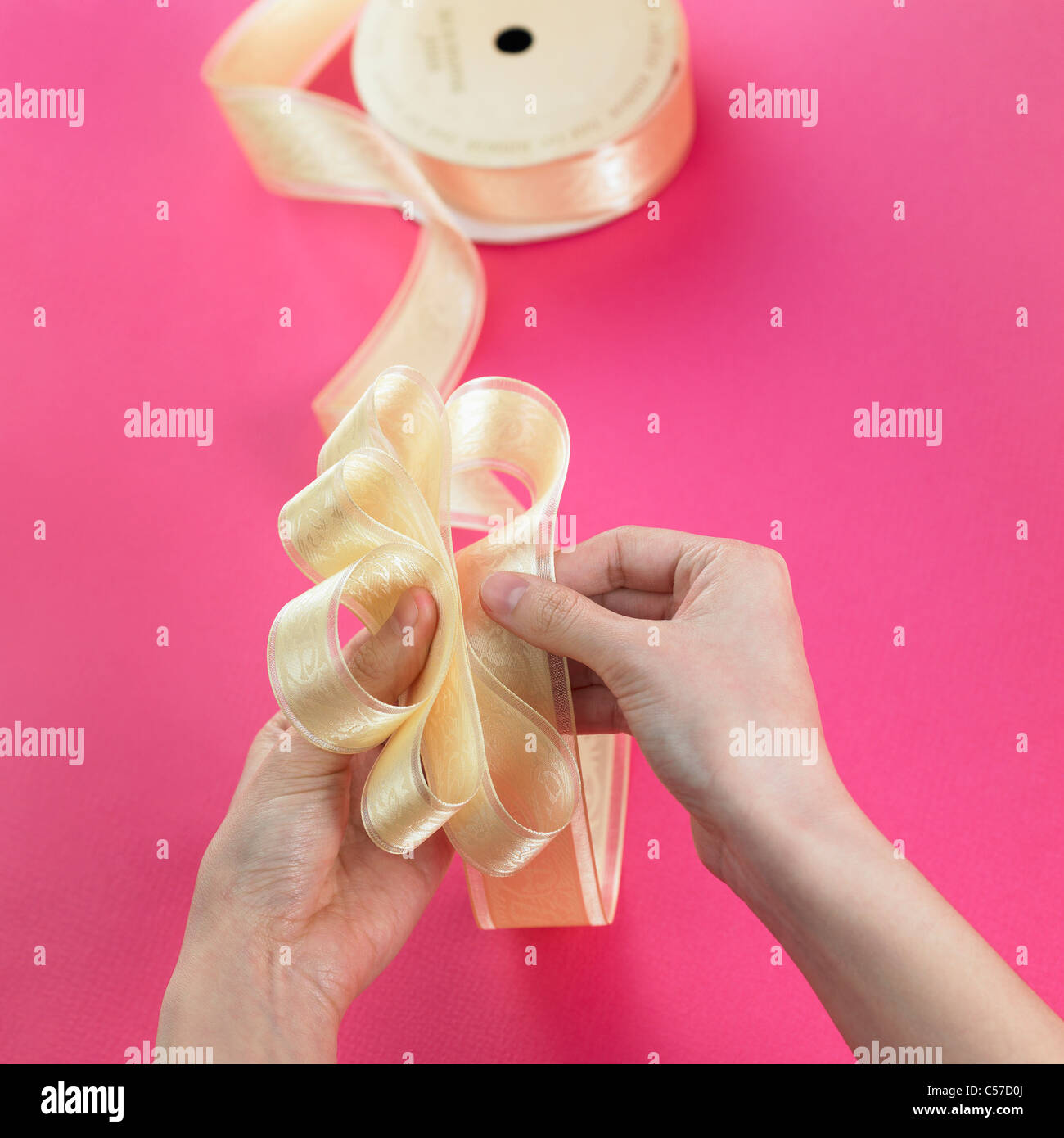 hands tie up ribbon Stock Photo - Alamy