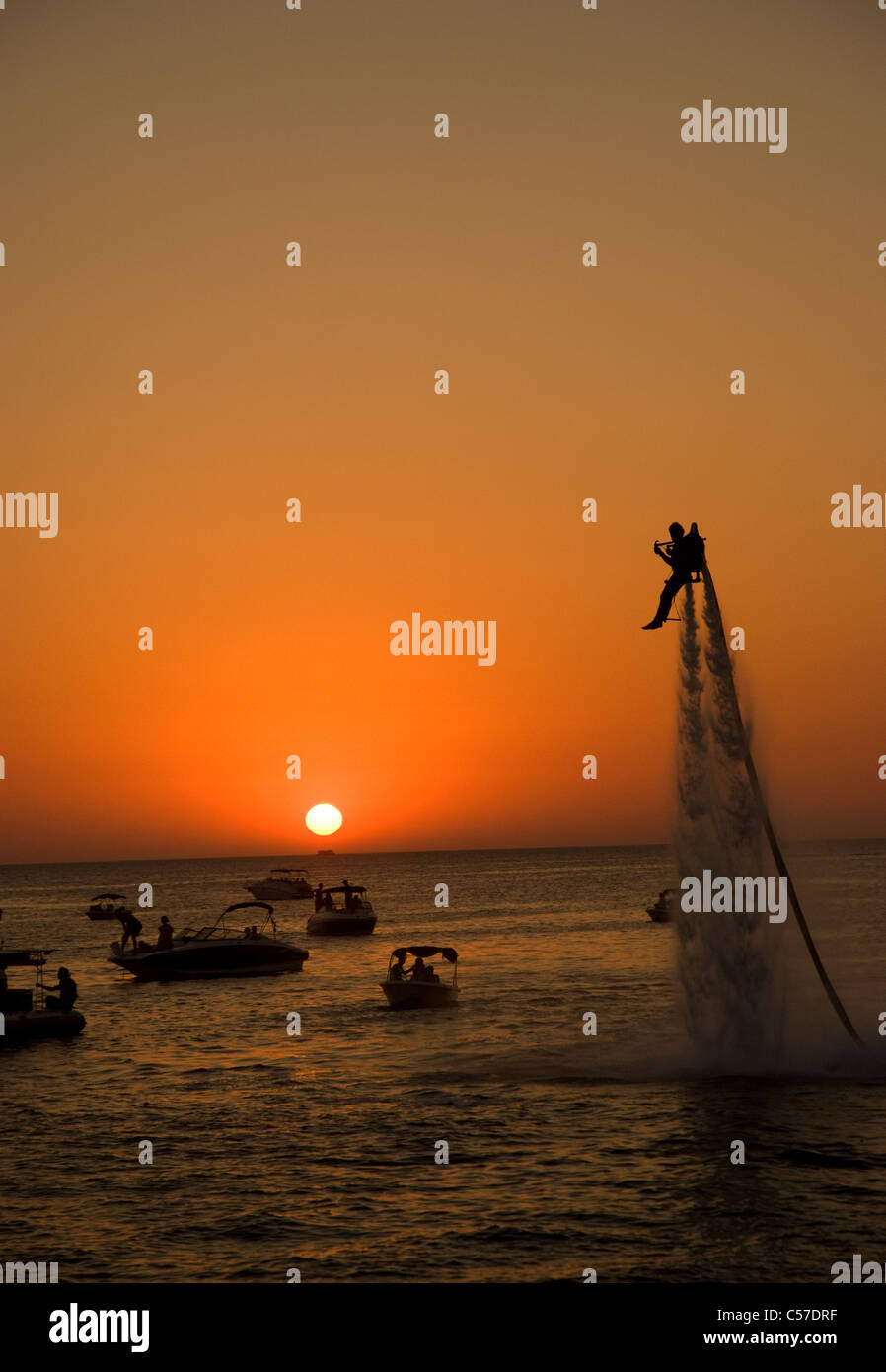 a man showboats using a water jet pack along the  world famous San Antonio Sunset strip Stock Photo