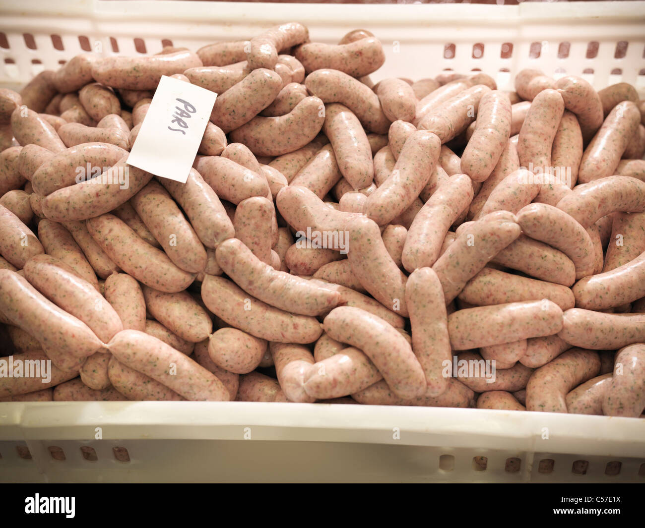 Parsley sausages in meat factory Stock Photo