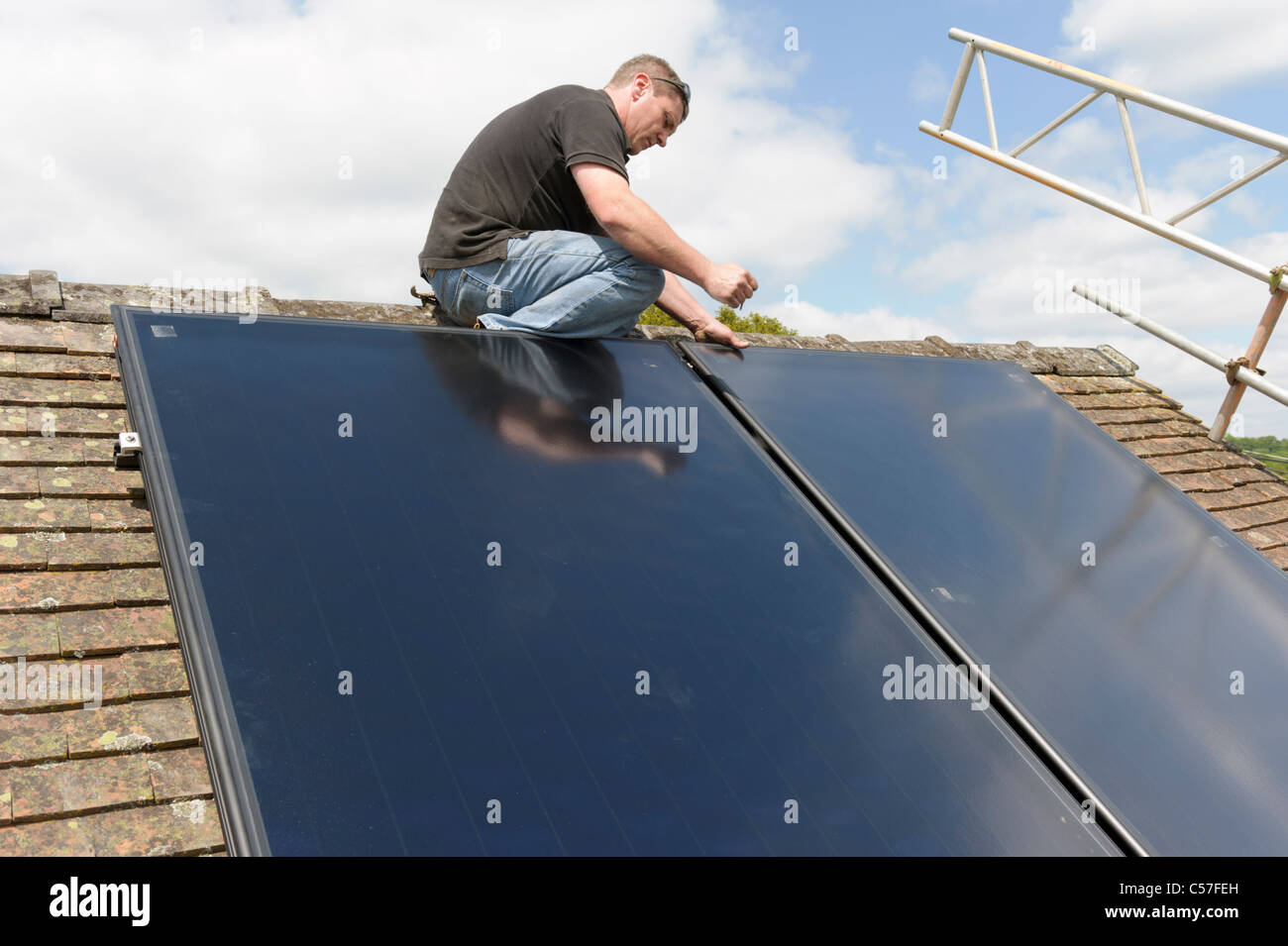 Solar thermal collector panel installation on domestic house Stock Photo