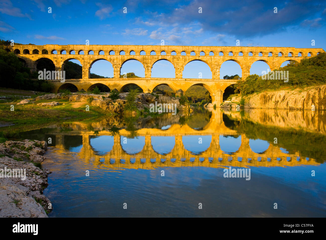 Pont du Gard, France, Europe, Languedoc-Roussillon, river, flow, bridge, aqueduct, Roman site, place, reflection, morning light Stock Photo