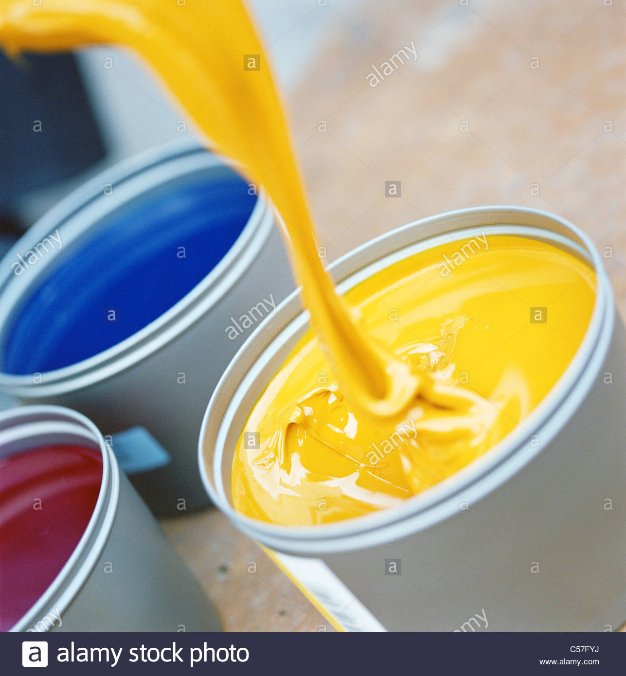Download Yellow Paint Pouring Into Bucket Stock Photo Alamy PSD Mockup Templates