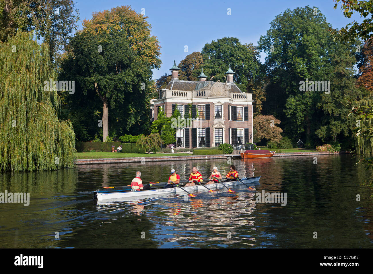 The Netherlands, Nieuwersluis, Rural estate called Rupelmonde along river Vecht. Local rowing club training. Stock Photo