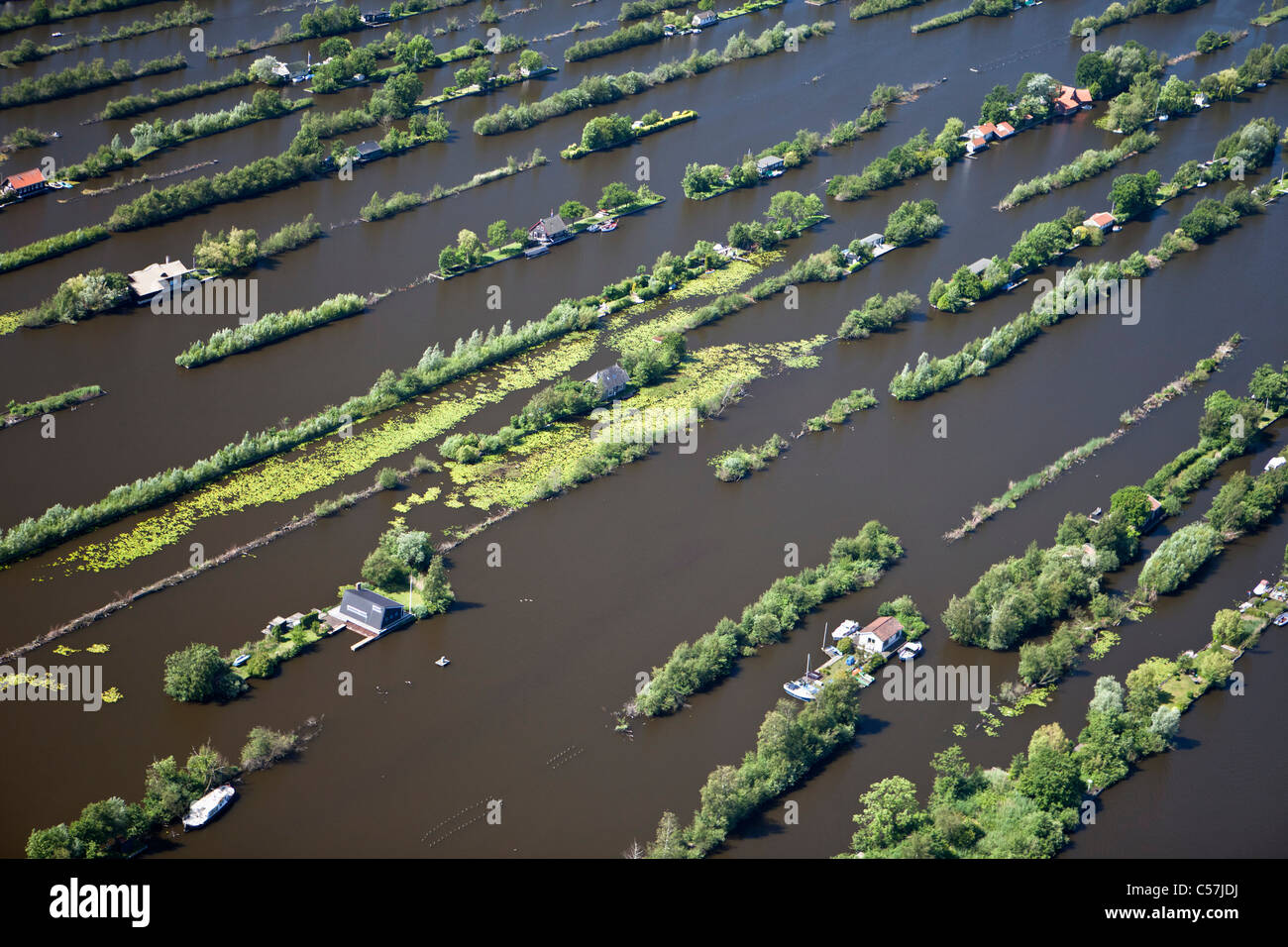 The Netherlands, Breukelen, Dugged out land in marsh. Aquatic sports. Housing holiday houses. Aerial. Stock Photo