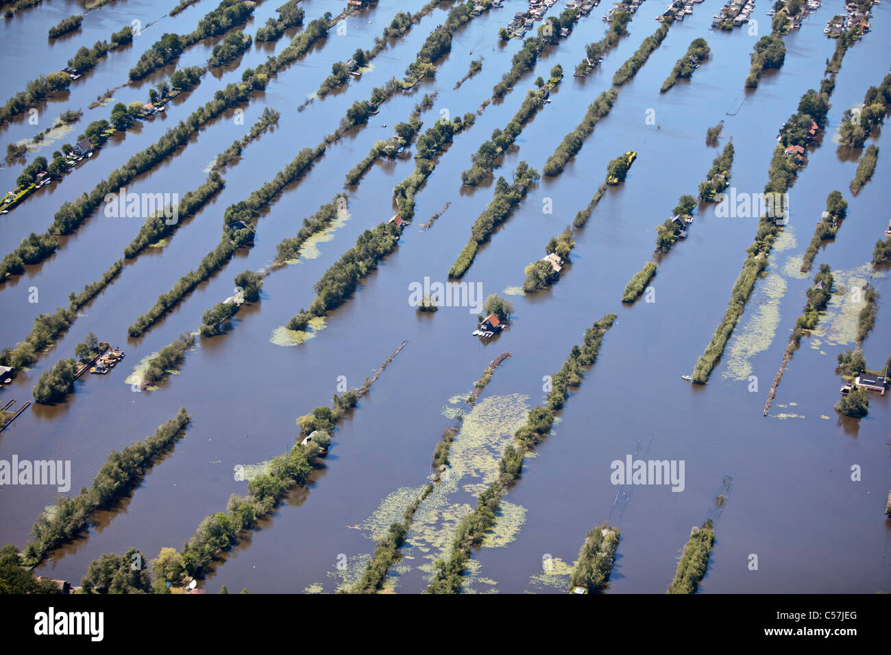 The Netherlands, Breukelen, Dugged out land in marsh. Aquatic sports. Housing holiday houses. Aerial. Stock Photo
