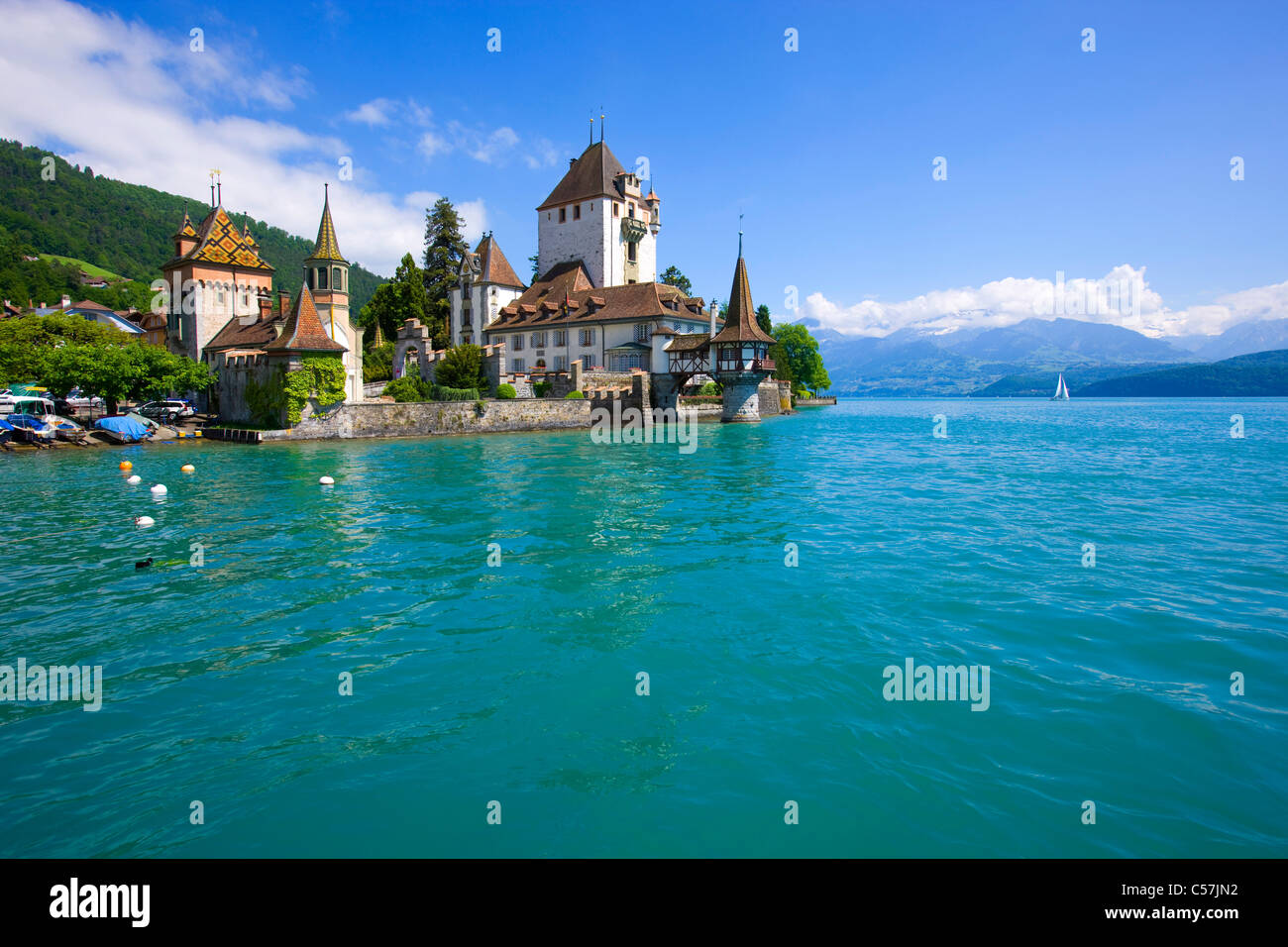 Oberhofen, Switzerland, Europe, canton Bern, lake, sea, lake of Thun, castle, lock, clouds Stock Photo