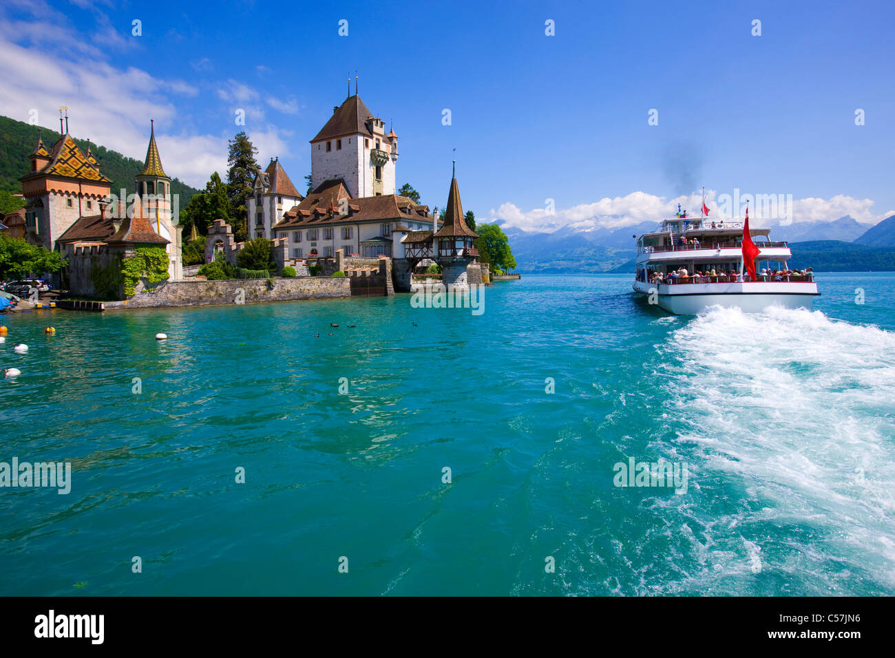 Oberhofen, Switzerland, Europe, canton Bern, lake, sea, lake of Thun, castle, lock, clouds, ship, traffic, tourism Stock Photo