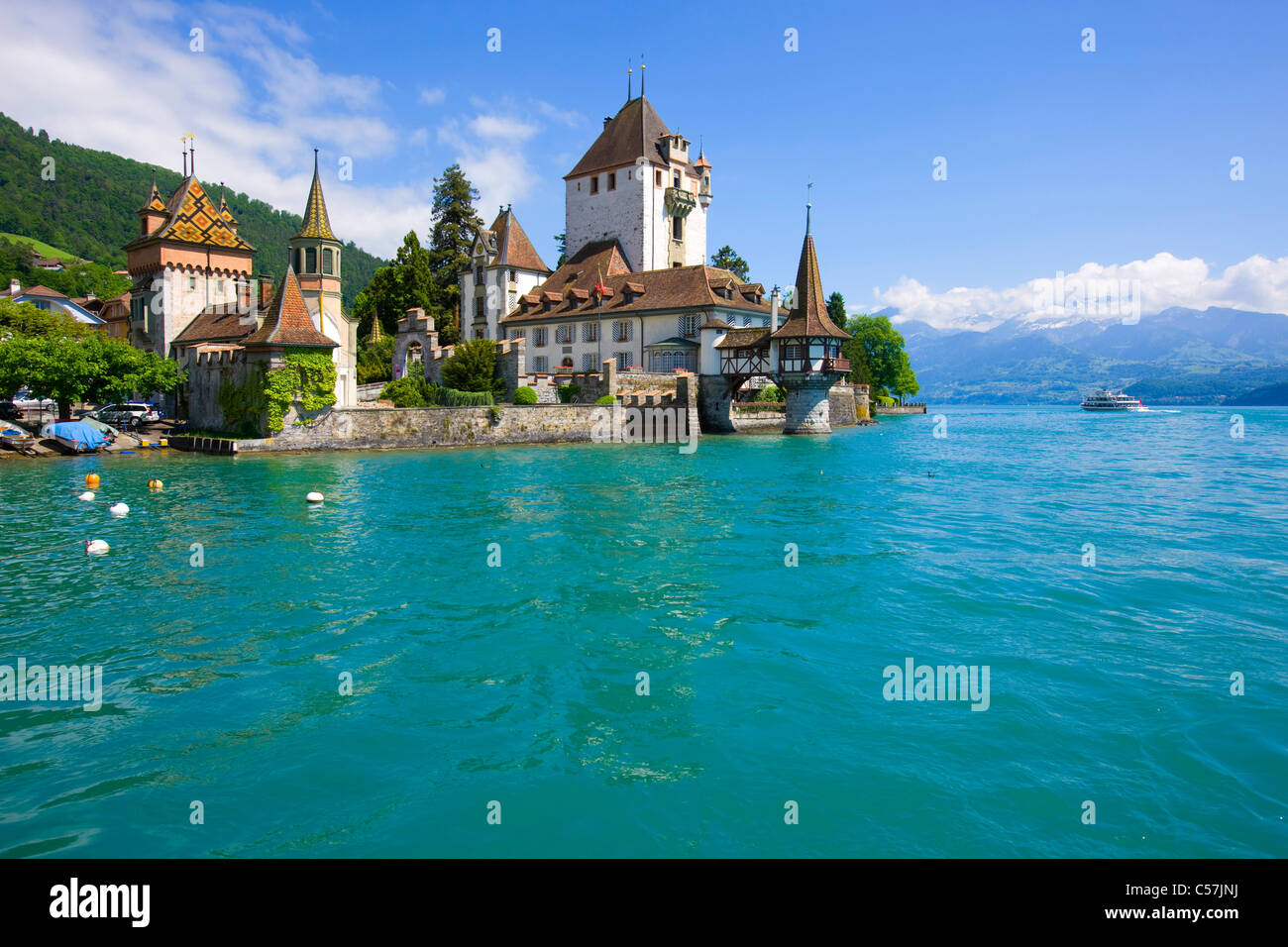 Oberhofen, Switzerland, Europe, canton Bern, lake, sea, lake of Thun, castle, lock, clouds, ship, traffic, tourism Stock Photo