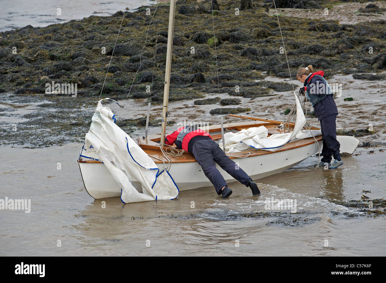 Sailors getting boat ready to sail Stock Photo