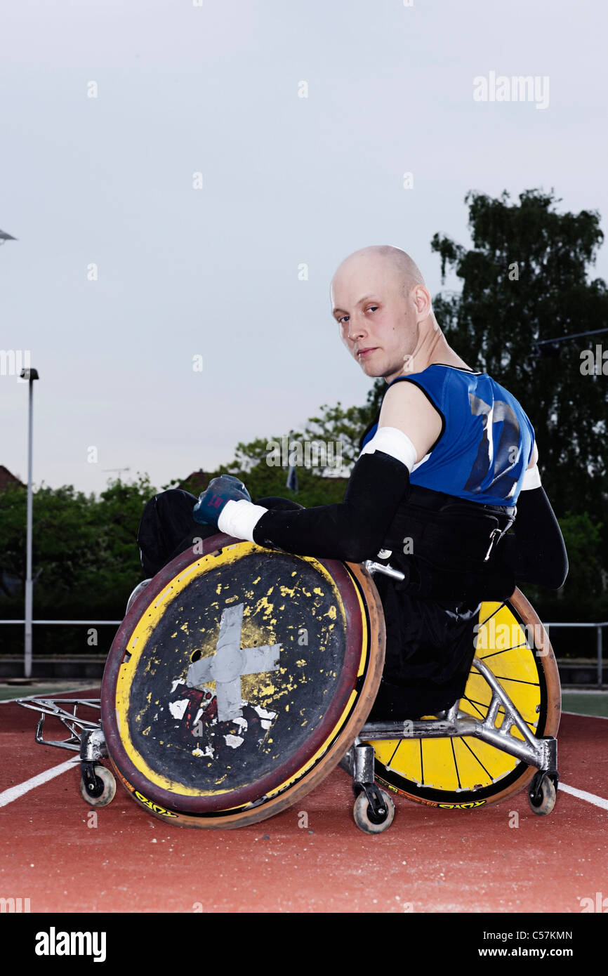 Para rugby player in wheelchair on track Stock Photo