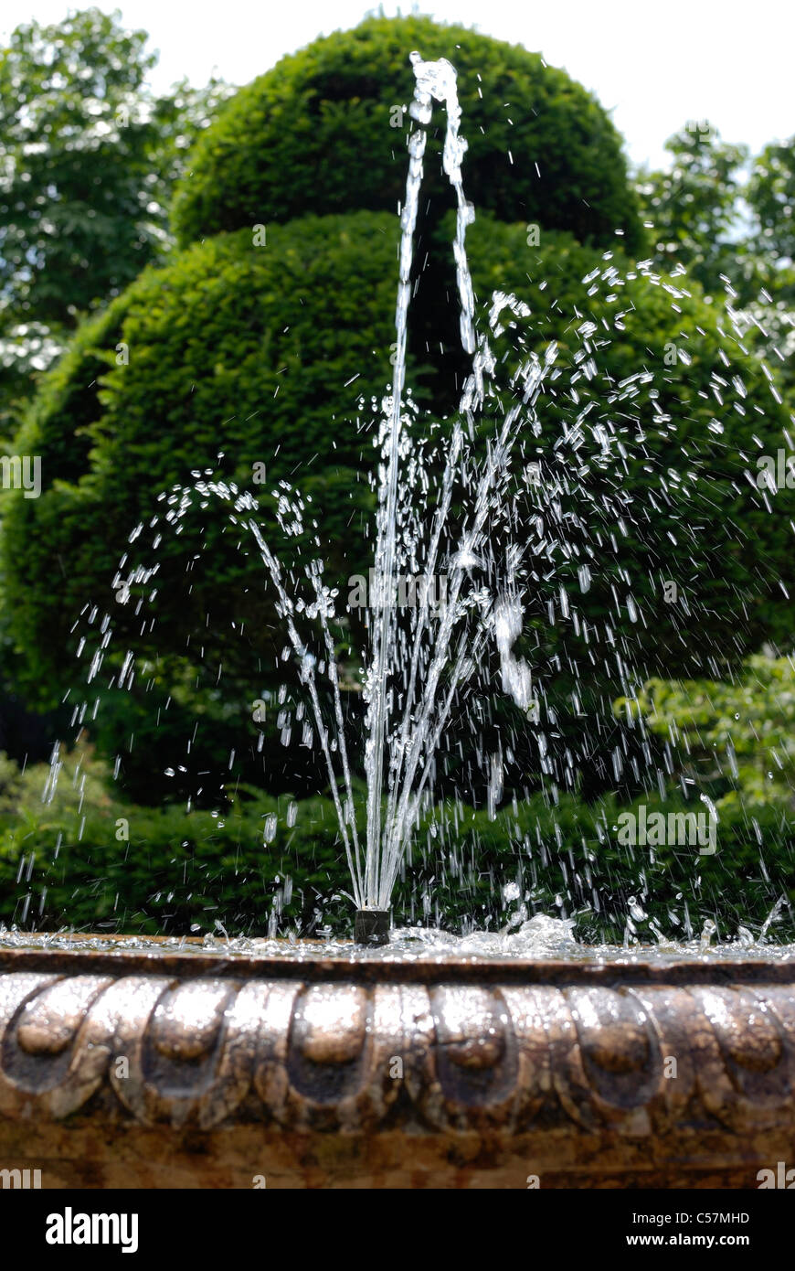 Water fountain in an English country garden Stock Photo