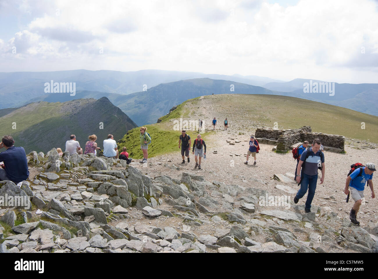 A busy day on Helvellyn summit, with Striding Edge on the left, Lake District, Cumbria Stock Photo