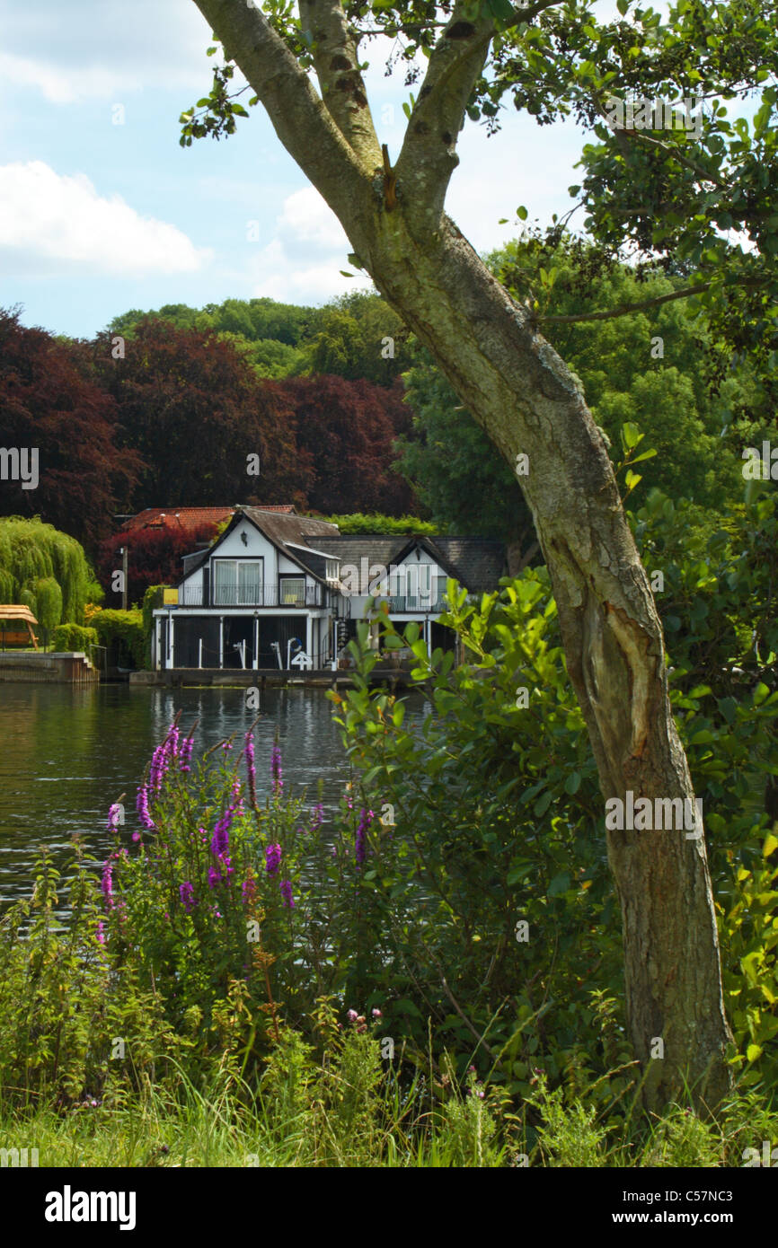 A house on the banks of the River Thames, Berkshire, United Kingdom, viewed from the Thames Path National Trail, Buckinghamshire Stock Photo