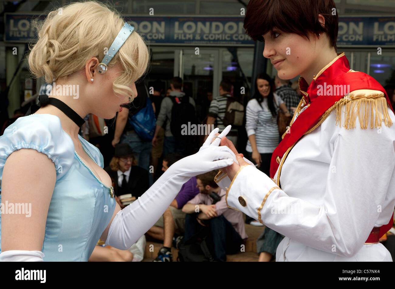 London Film & Comic Con 2011: Florence Roseberry-Haynes as Cinderella and Olivia Braddock as Prince Charming Disney characters Stock Photo