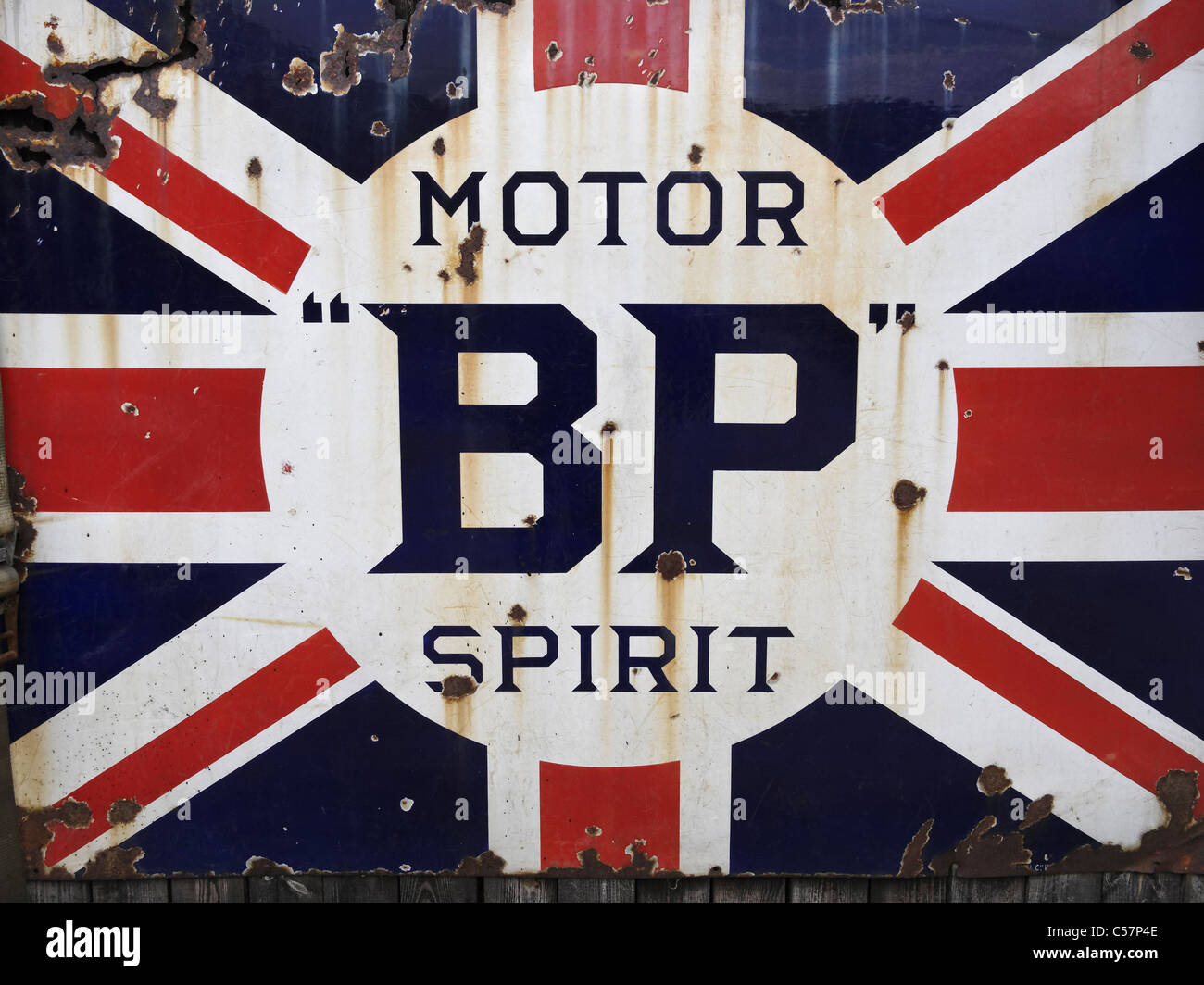 An old enamel sign advertising BP Motor Spirit petrol. Stock Photo