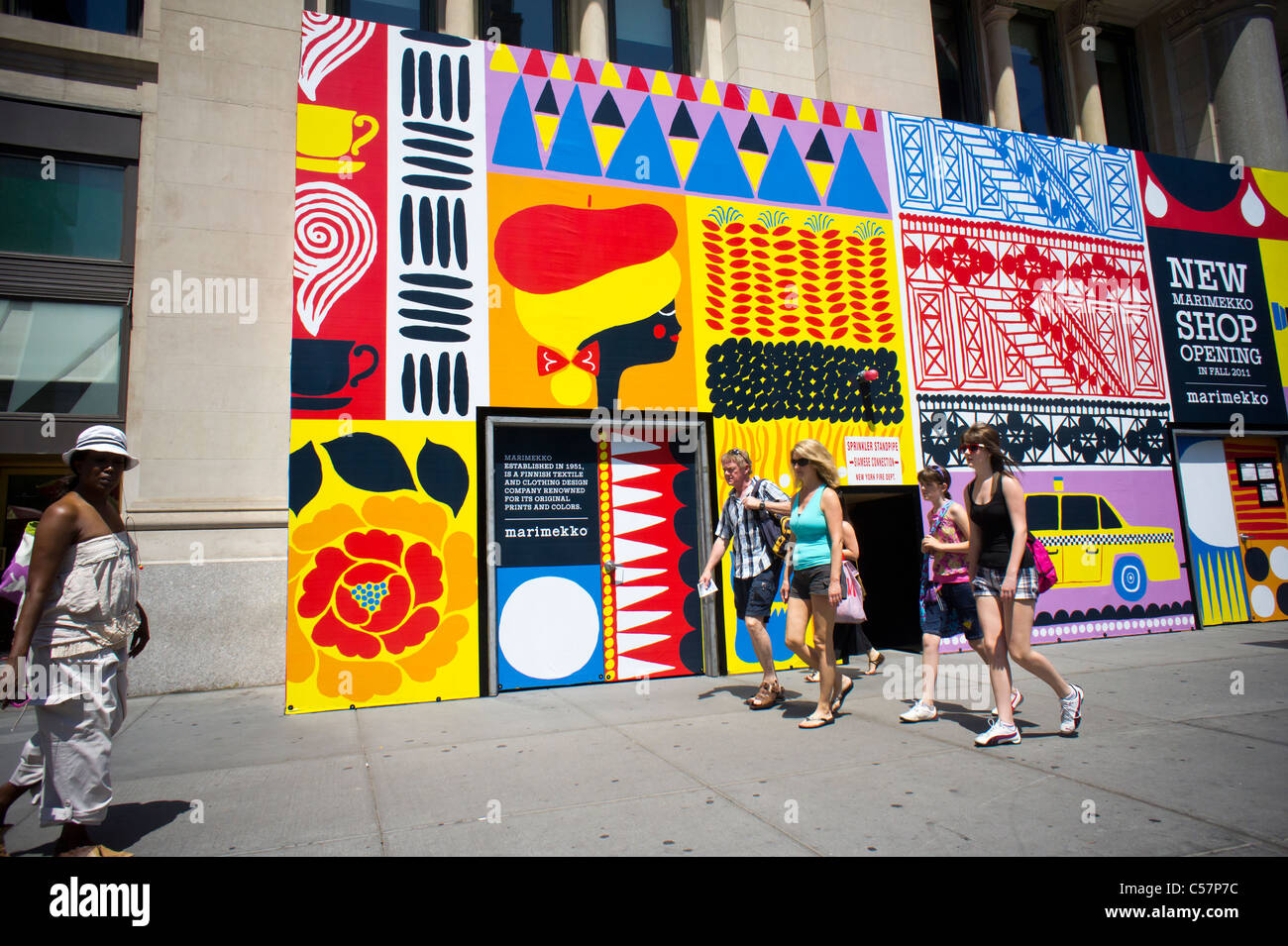 A billboard on a construction shed in the Flatiron District in New York  announces the eminent arrival of a Marimekko store Stock Photo - Alamy