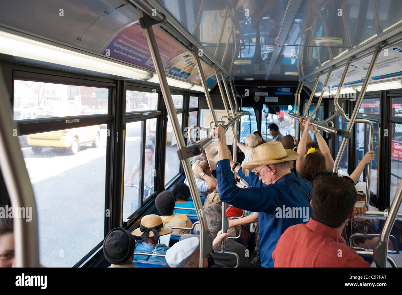 Commuters aboard a crowded New York City Transit Authority bus in New