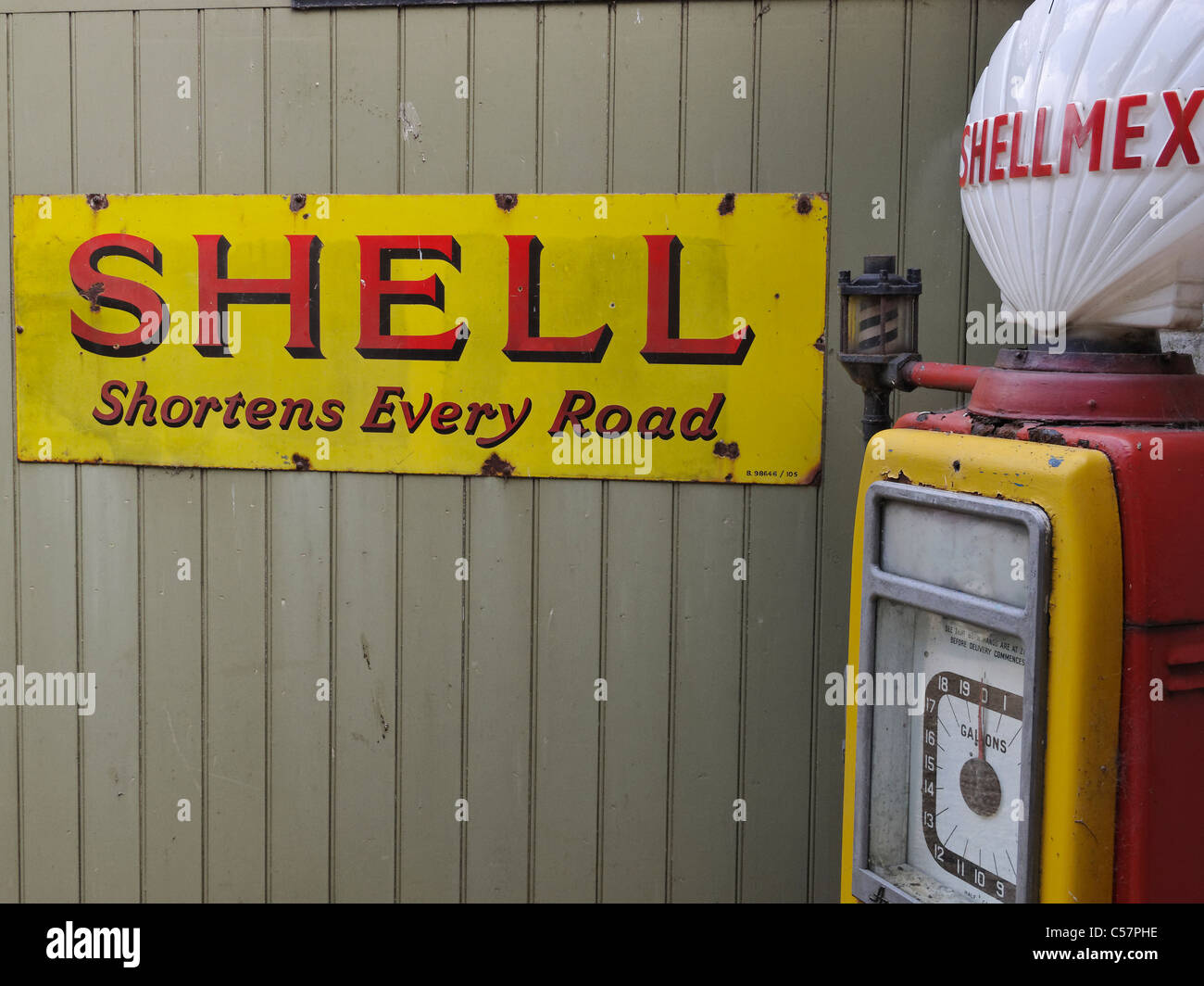An old Shellmex petrol pump and Shell enamel sign. Stock Photo