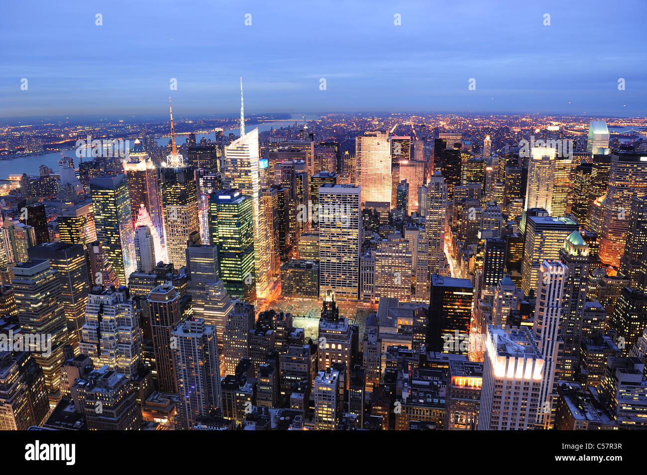 New York City Manhattan Times Square night city skyline aerial view with urban skyscraper illuminated. Stock Photo