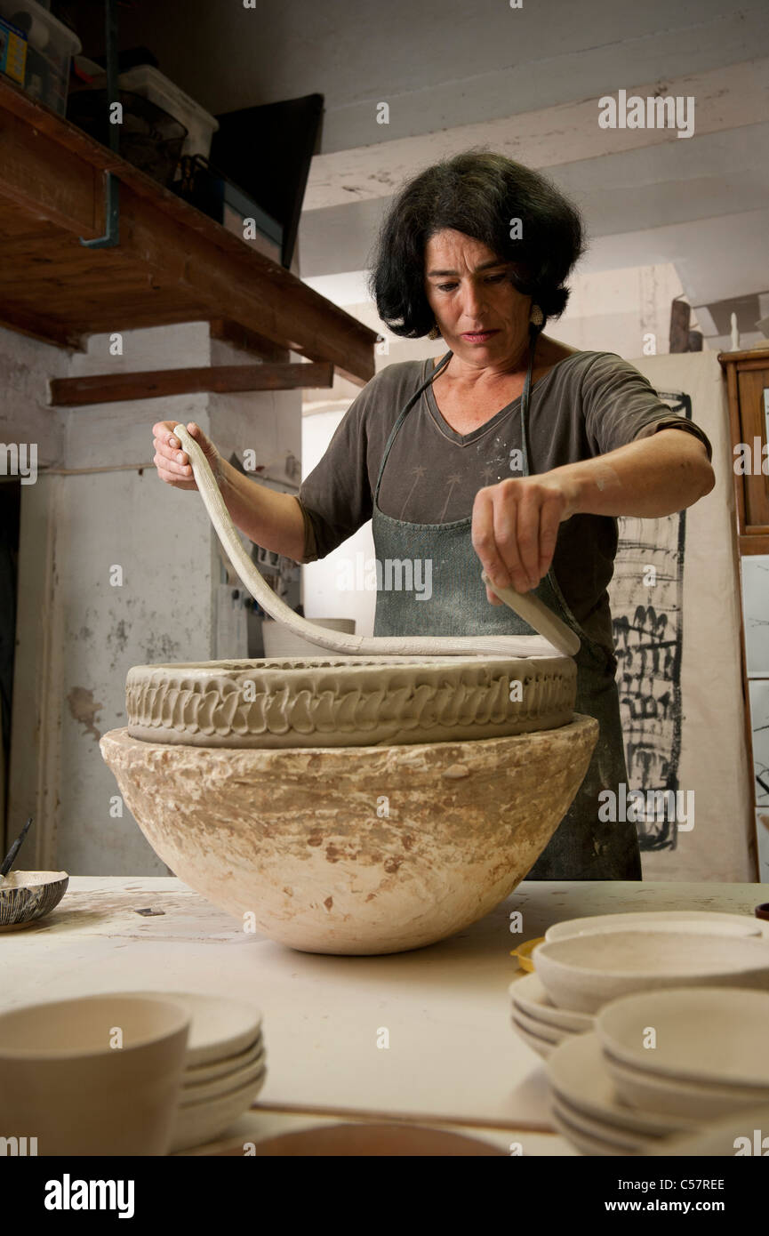 Female ceramicist working on a ceramic piece in her Barcelona, SPAIN Stock Photo Alamy