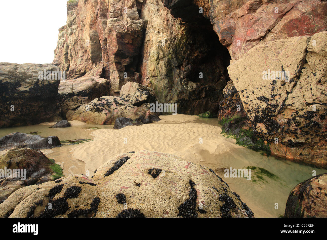 Sea cave at Chapel Porth beach, North Cornwall, England, UK Stock Photo