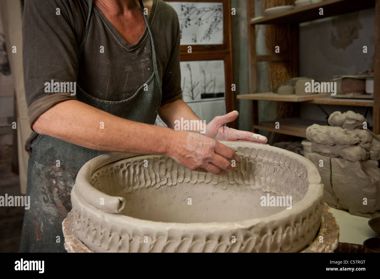 Female ceramicist working on a ceramic piece in her Barcelona, SPAIN Stock Photo Alamy