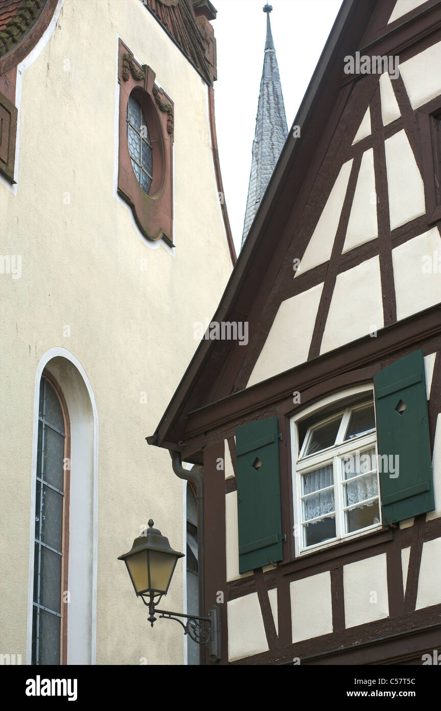 Detail of an old house and a church with half-timbering in the city of Haslach, Schwarzwald, Baden-Wurttemberg, Germany Stock Photo