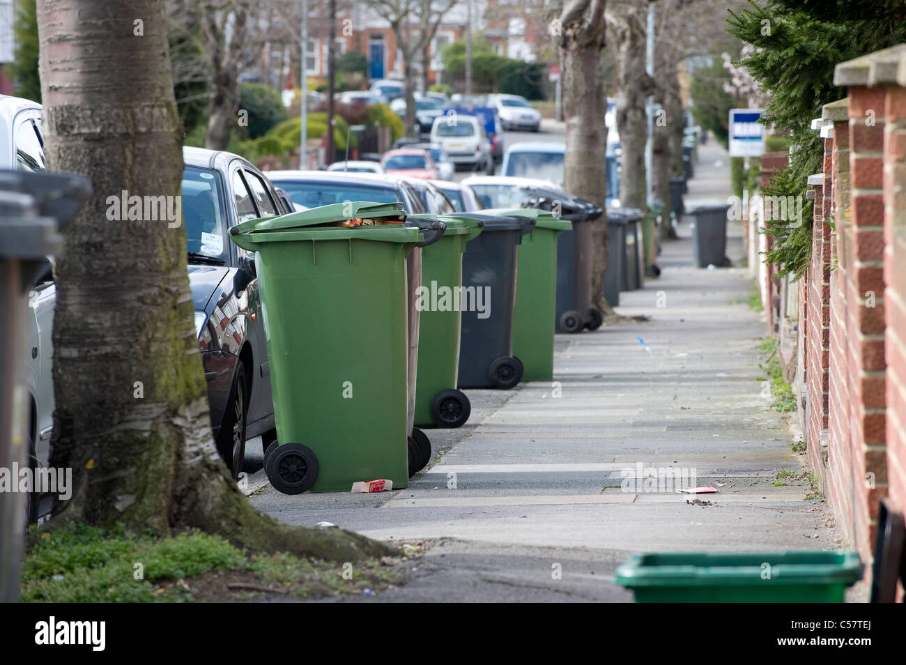 Black green wheelie bins outside hi-res stock photography and images ...
