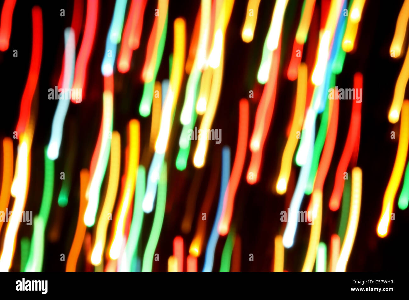 Multicolored streaks of light against a black background Stock Photo ...