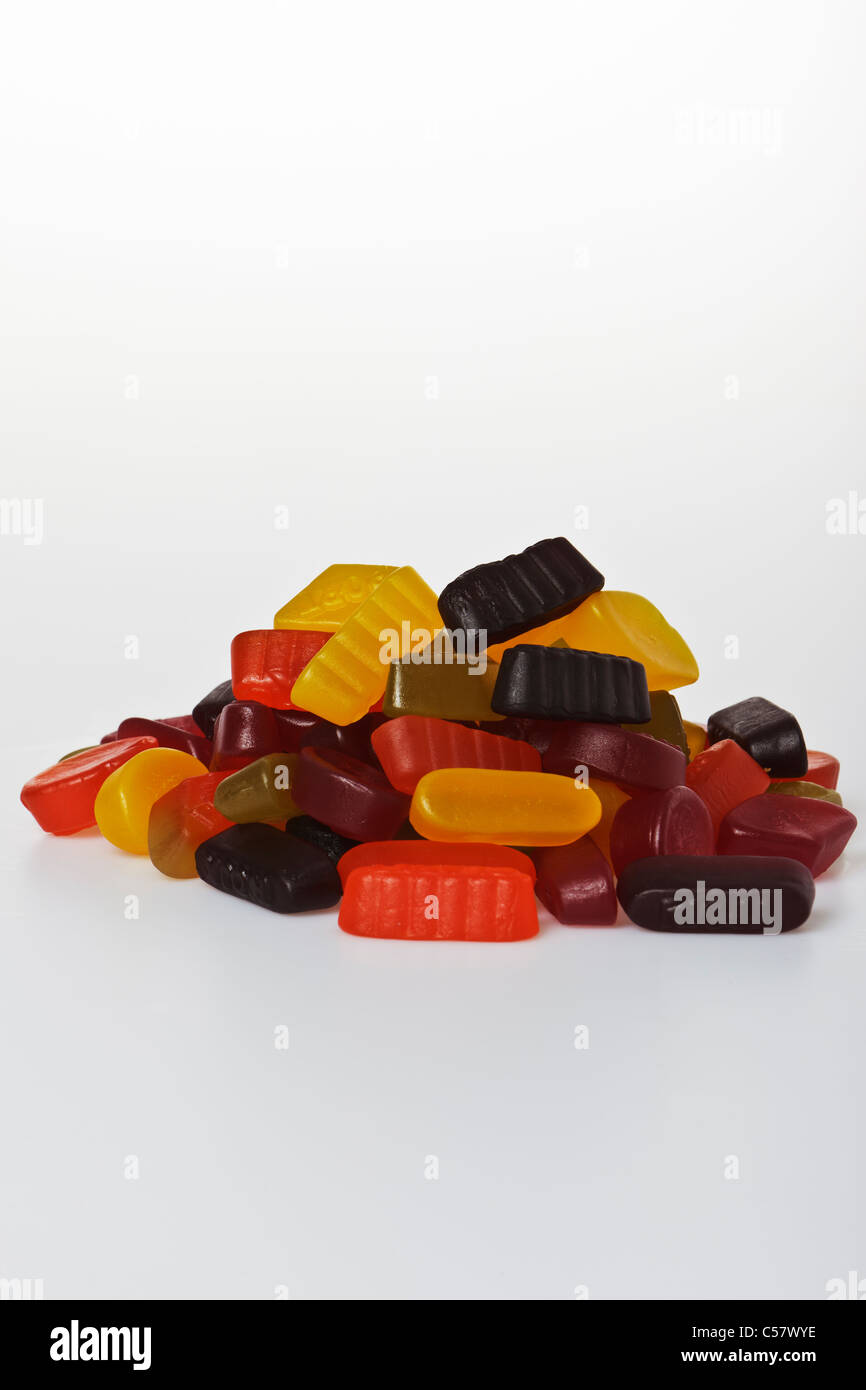 Pile of wine gums against a plain white background Stock Photo Alamy