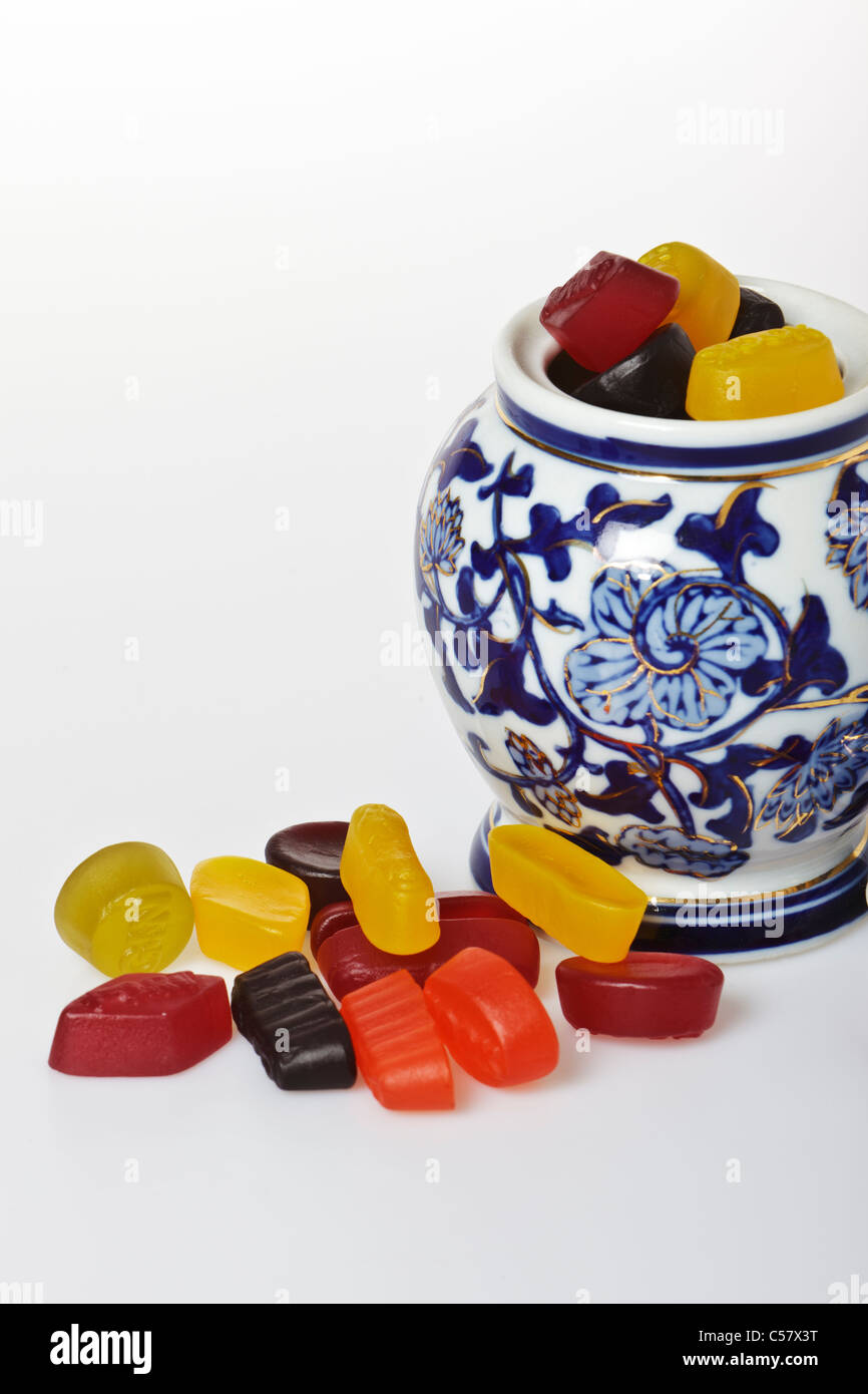 Jar with wine gums against a plain white background Stock Photo Alamy