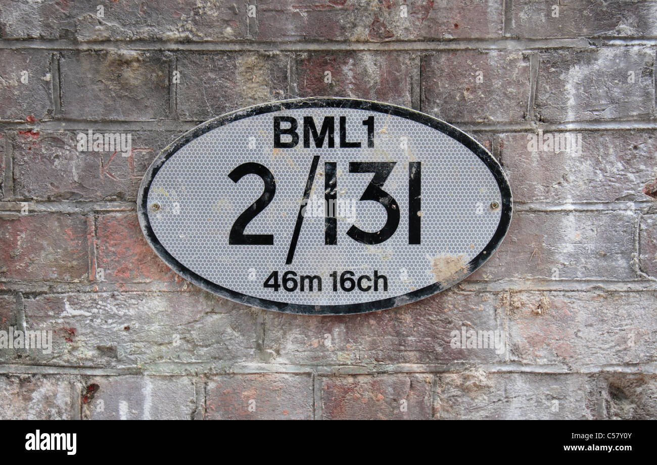 Railway bridge identification number plaque BML1 2/131 46m 16ch, Old Basing, Basingstoke, Hampshire, England Stock Photo