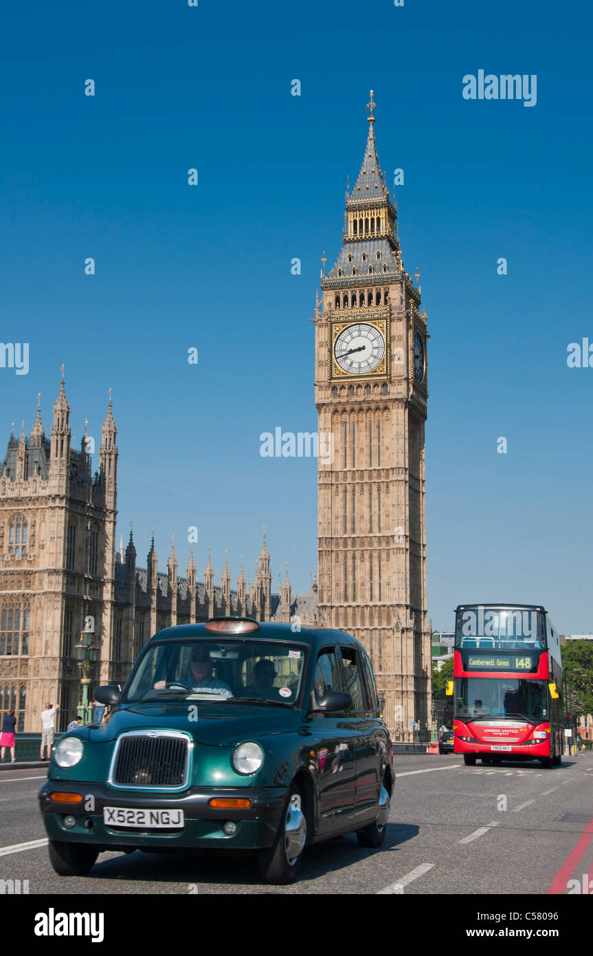 Black taxi and red bus near Houses of Parliament, London, UK Stock Photo