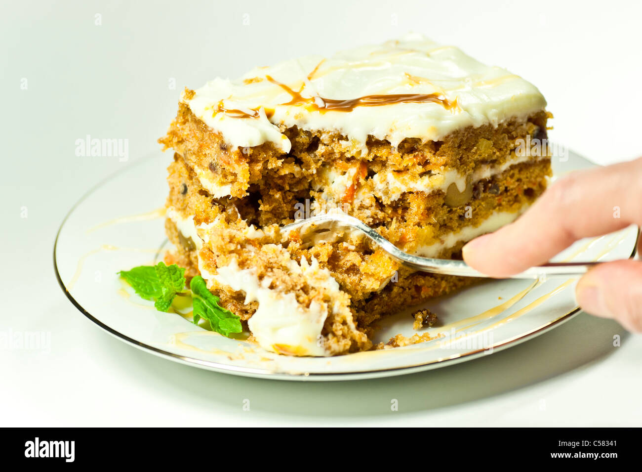 Freshly baked Carrot Cake with caramel vanilla frosting. Stock Photo