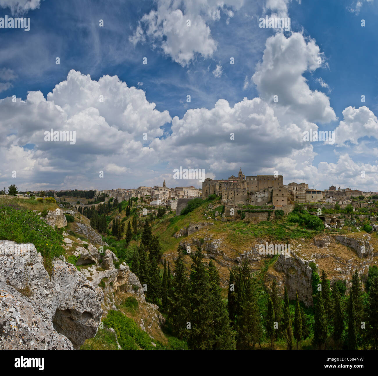 Italy, Europe, Village, edge, ravine, Gravina in Puglia, Puglia, city, village, spring, mountains, hills, clouds, Stock Photo
