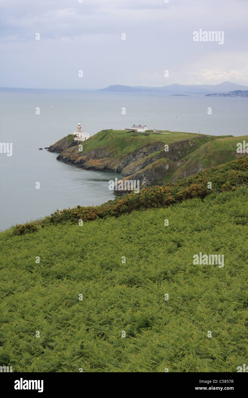 Ireland, Dublin, Howth, cliffs, sea, clouds, coast, lighthouse, green, plants, vegetation Stock Photo