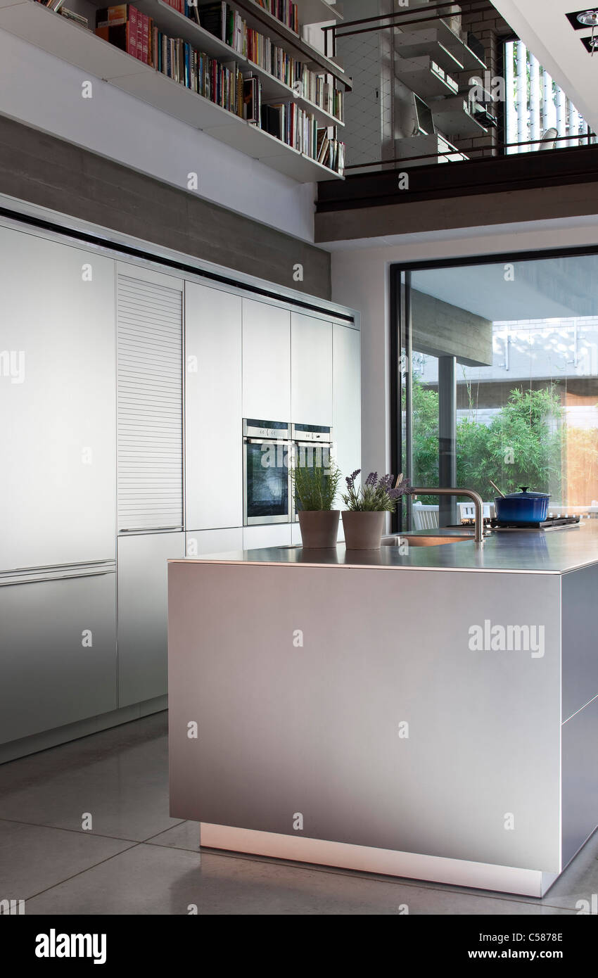 Modern kitchen in a double height space Stock Photo - Alamy