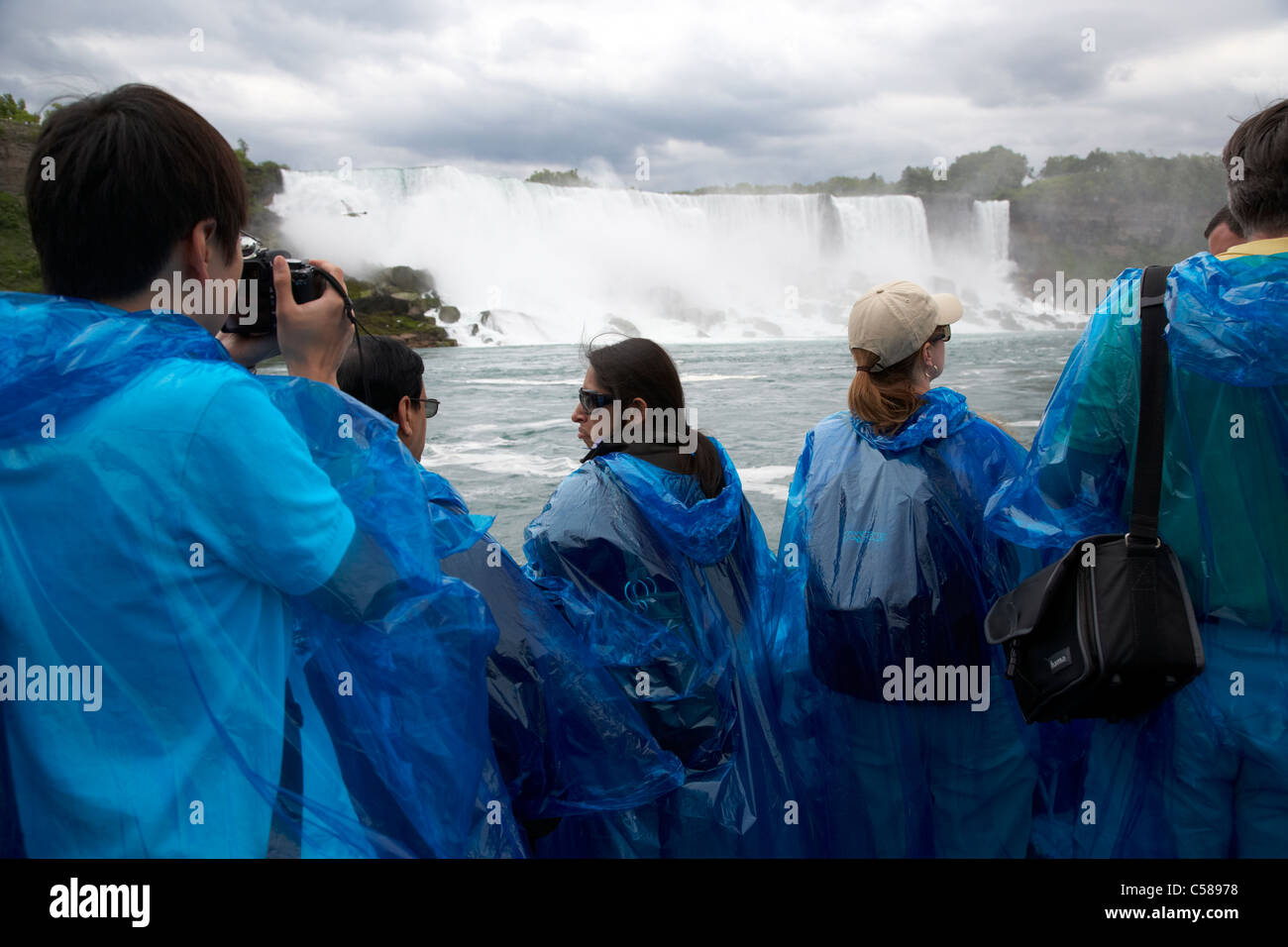 tourists in blue plastic waterproof ponchos at the maid of the mist niagara  falls ontario canada Stock Photo - Alamy