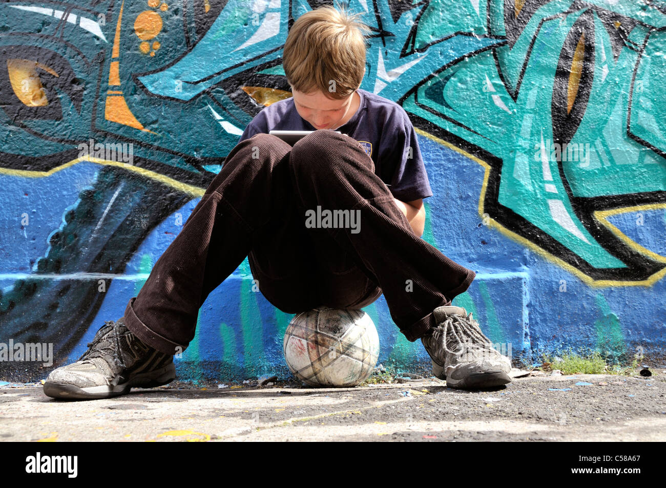 Boy, play, Nintendo, graffiti, spraying, ball, graffiti wall, soccer,  football, place, Germany, Europe Stock Photo - Alamy