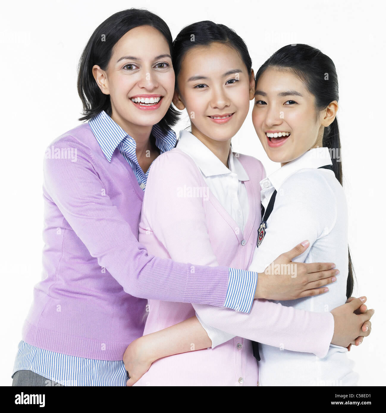 Portrait of student and teacher standing by white background Stock ...