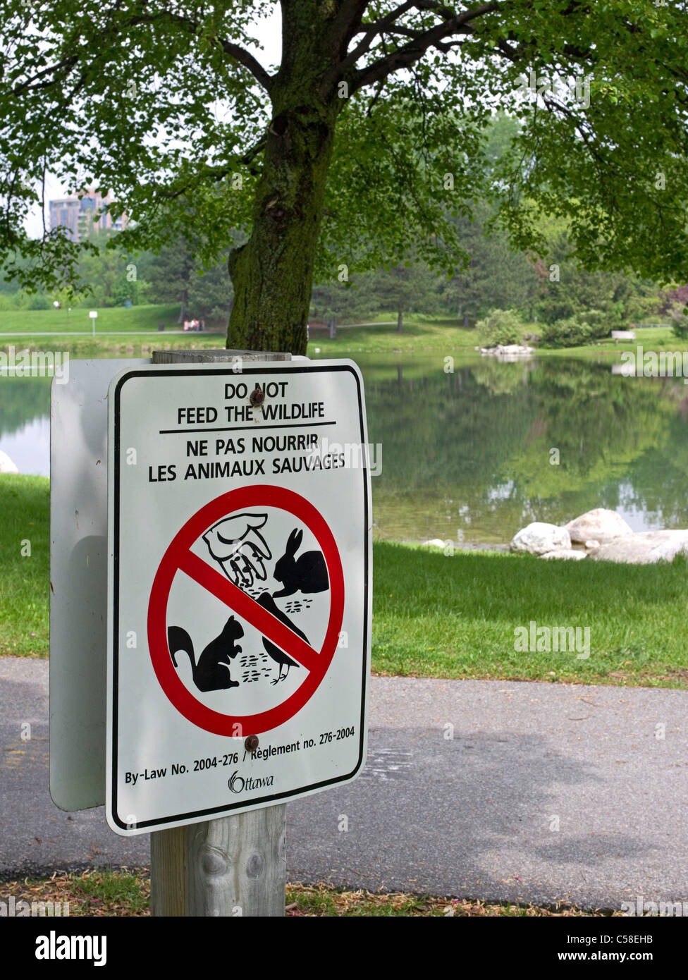 Dual language sign in riverside park in Ottawa Stock Photo