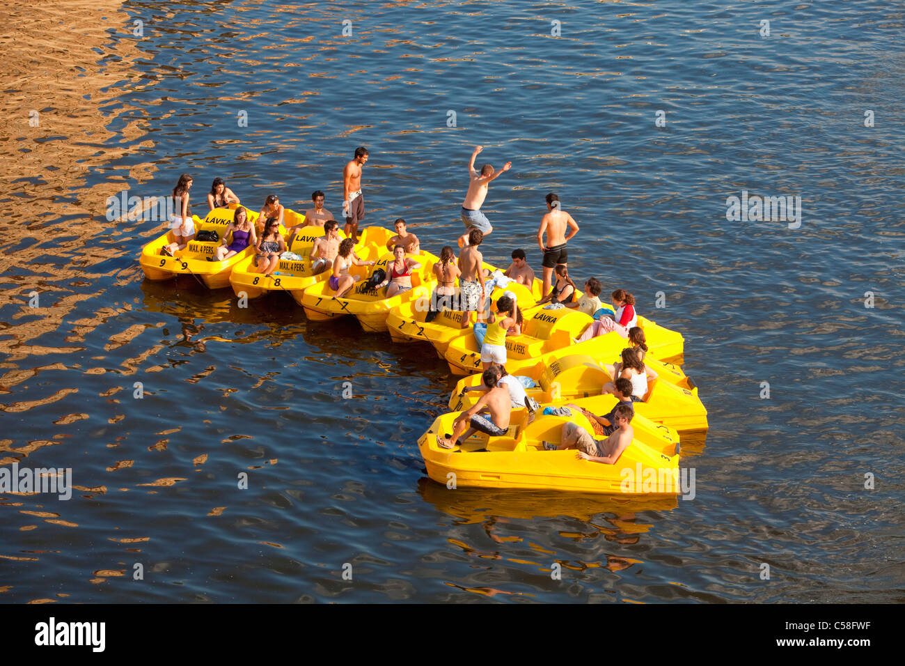 boat, boats, city, Czech republic, day, daytime, Europe, fun, Prague, pedalos, people, river, summer, Vltava, water Stock Photo