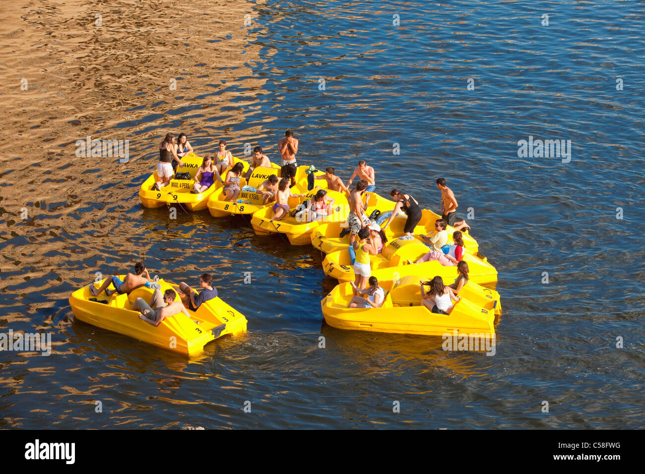 boat, boats, city, Czech republic, day, daytime, Europe, fun, Prague, pedalos, people, river, summer, Vltava, water Stock Photo