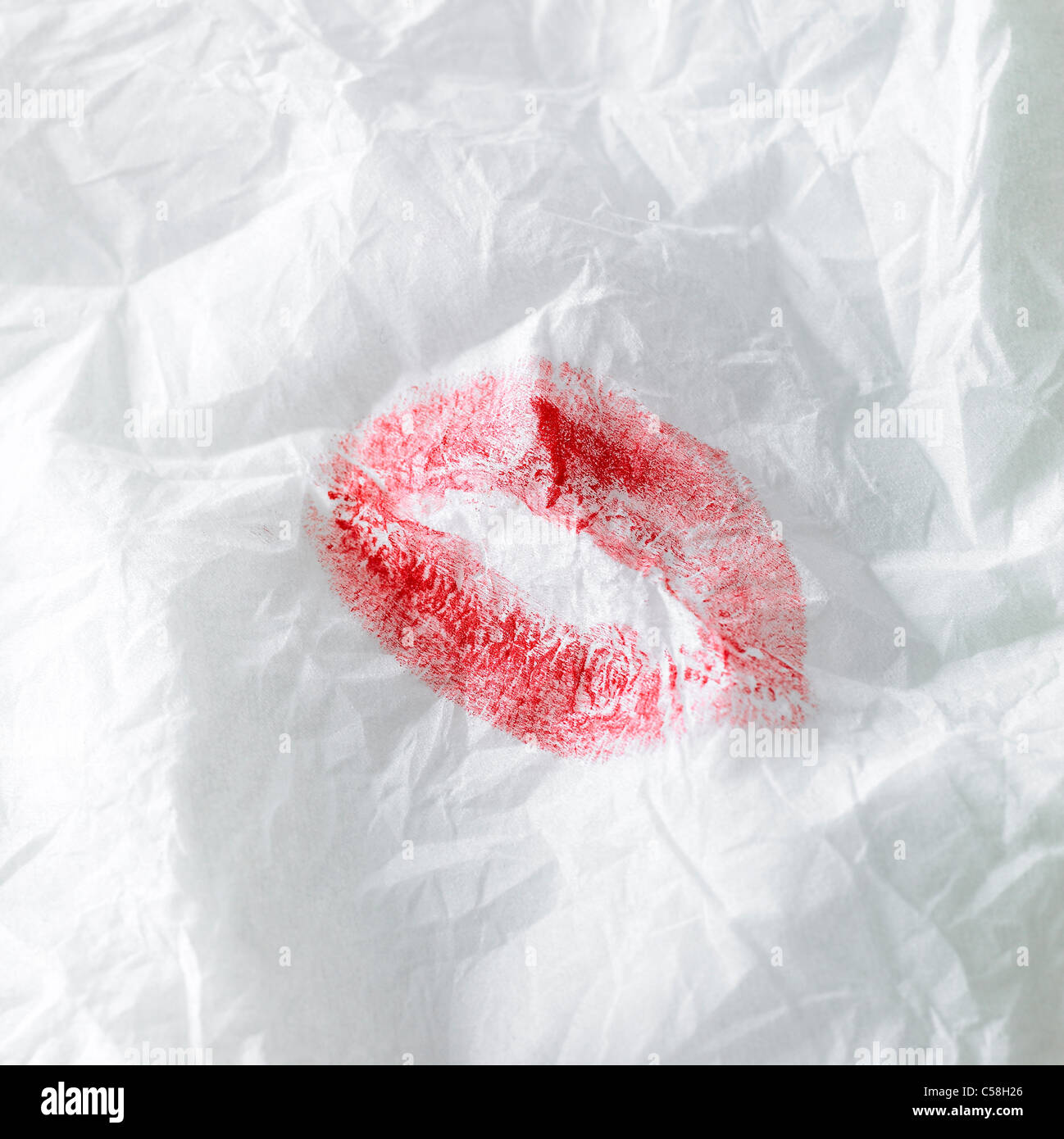 Close-up of Lipstick Kiss on Napkin Stock Photo