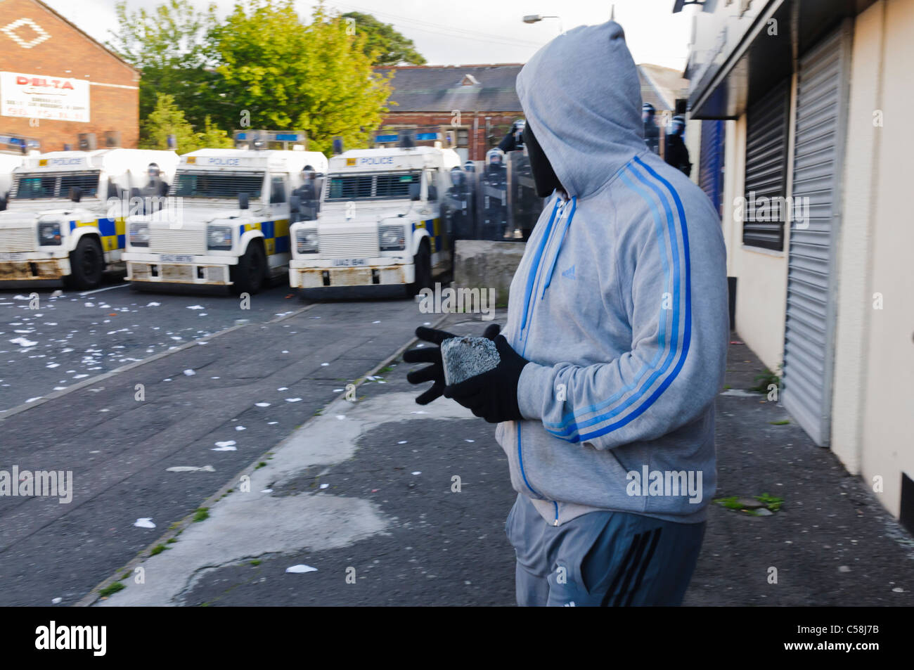 Rioter throwing brick hires stock photography and images Alamy