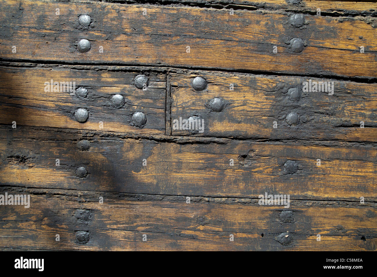 Hull boarding of an old wooden steam ship . Boards treated ...