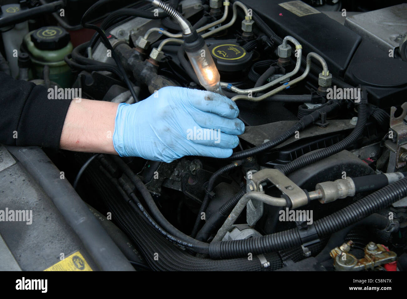 Engineer Testing the Electrical Circuits of a Modeo Motor Car Stock Photo