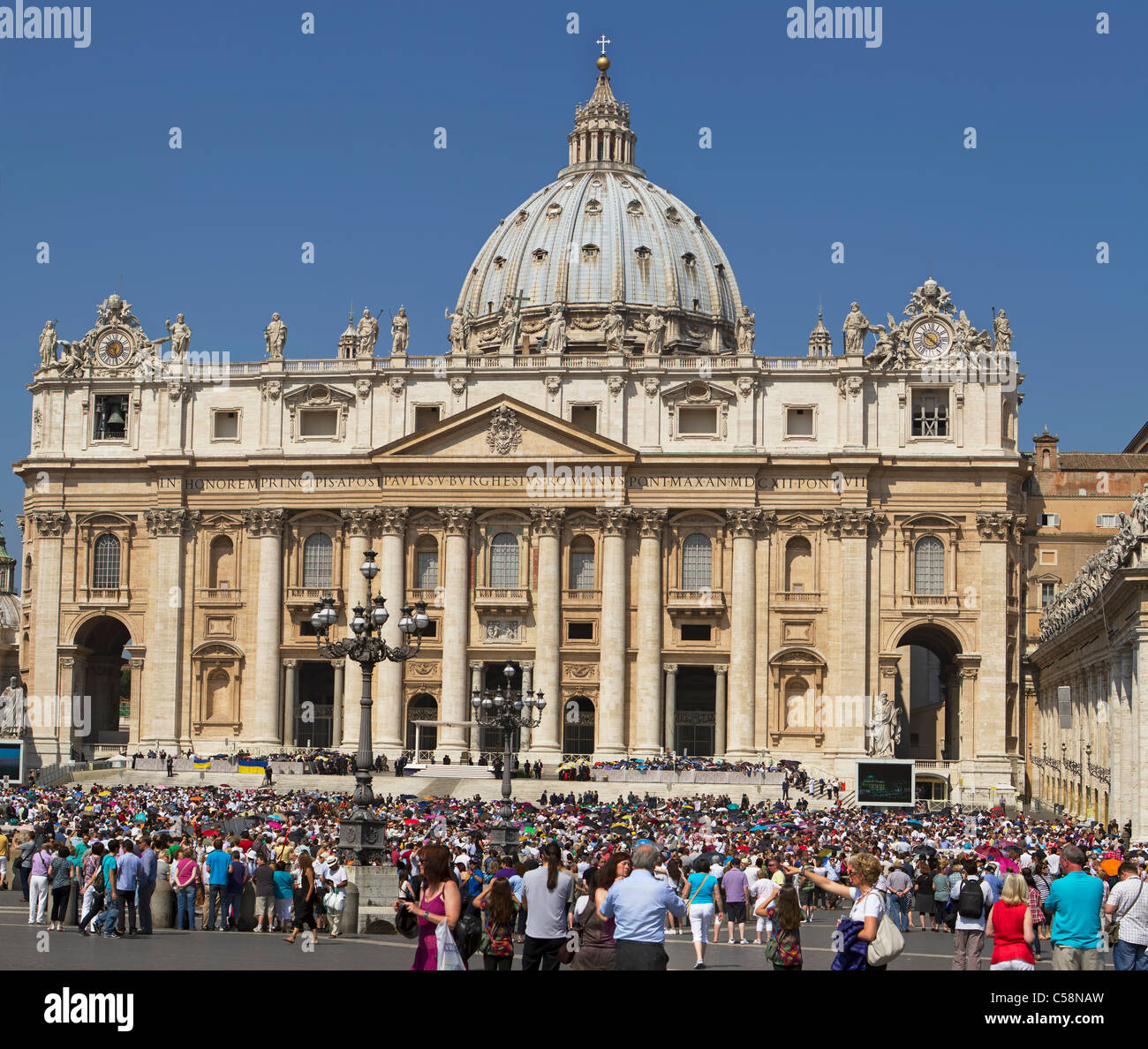 Vatican City Saint Peter's Square from center courtyard with crowds of people waiting to hear the Pope speak. Stock Photo