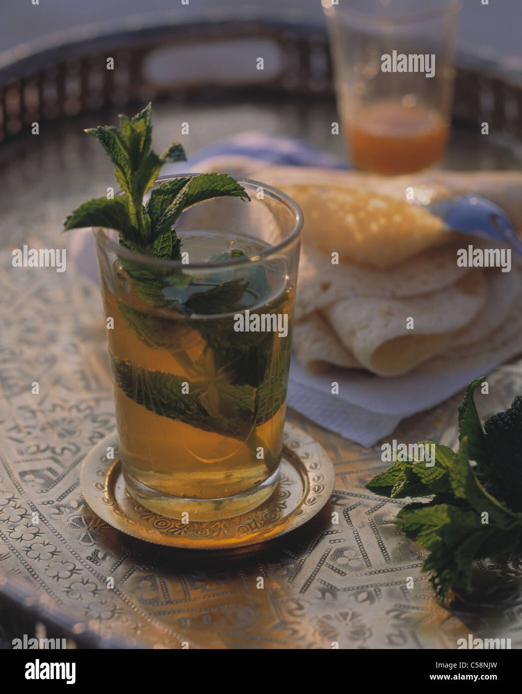 Still: Mint - tea with honey pancake (Beghir) Stock Photo